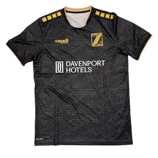 Black soccer jersey with a repeating "Z" gradient pattern, 'Davenport Hotels' logo, Spokane Zephyr "Z" crest, and capelli sport logo