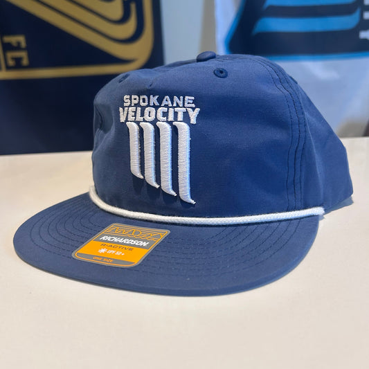 Blue flatbill rope cap with a white embroidered Spokane Velocity crest on a white surface