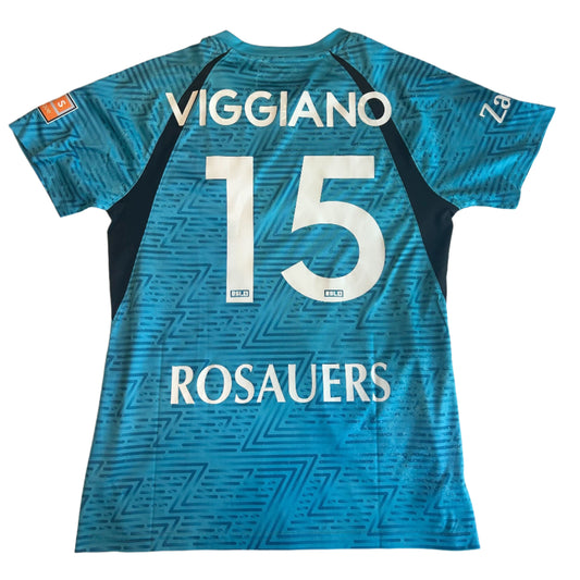 Blue sports jersey with 'Viggiano' and number '15' on a white surface